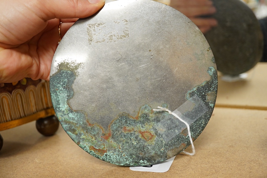 A Chinese silvered bronze mirror, a lacquer box and a jade cylindrical bead, largest 15cm diameter. Condition - fair to good